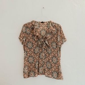 ruffled patterned blouse